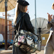 Jimmy gives direction to his camera crew's makeup artist on the grounds of a television station